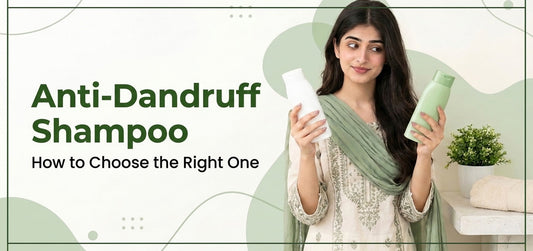  Woman comparing two shampoo bottles to choose an anti-dandruff shampoo