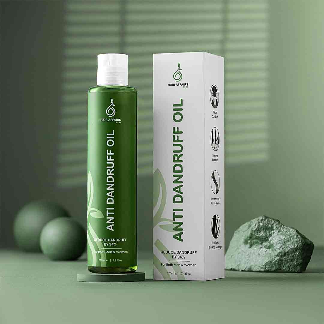 Green bottle and white box of Anti Dandruff Oil on a green background