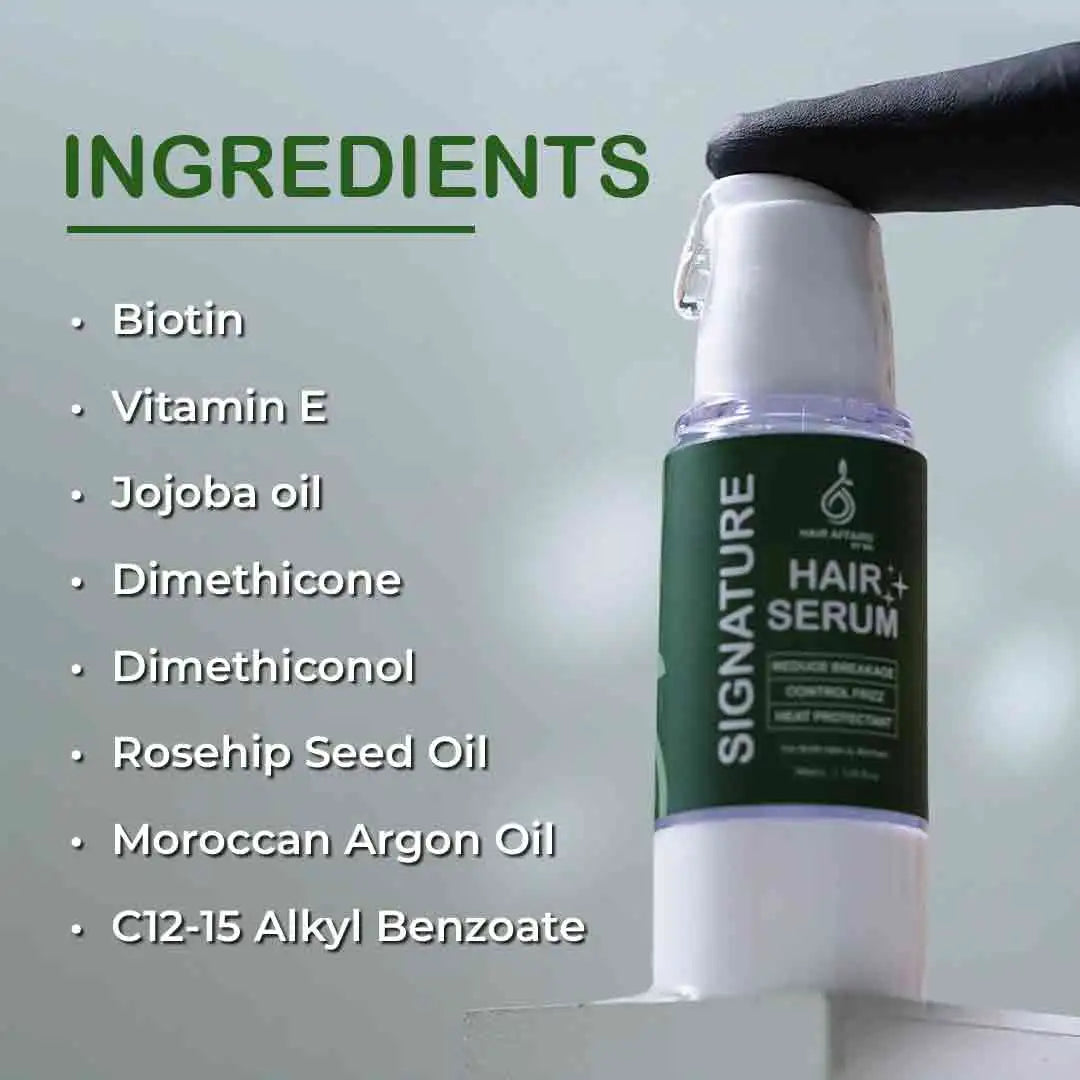 Hair serum bottle with ingredients listed on a light gray background
