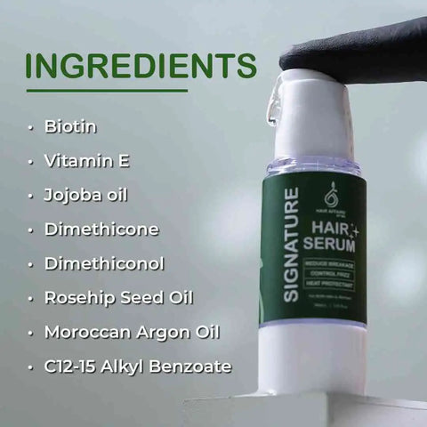 Hair serum bottle with ingredients listed on a light gray background